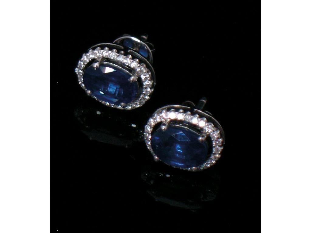 Appraisal: A PAIR OF SAPPHIRE AND DIAMOND EAR STUDS the oval