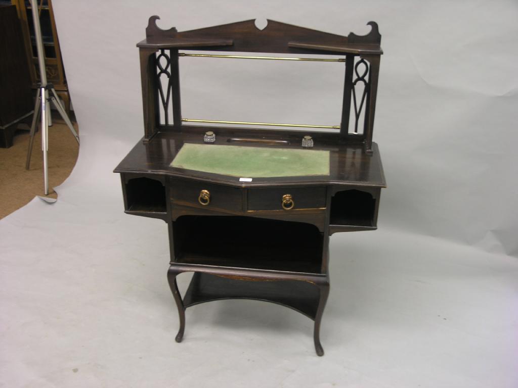 Appraisal: An Edwardian mahogany lady's writing table unusual form with overshelf