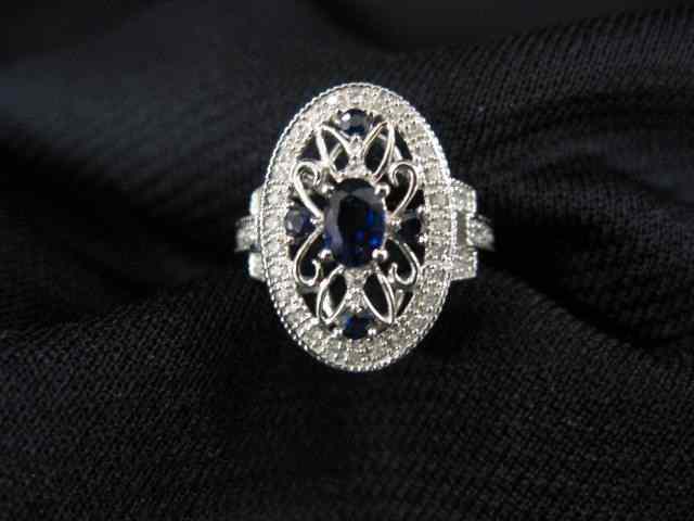 Appraisal: Sapphire Diamond Ring oval openwork setting with deep blue sapphire