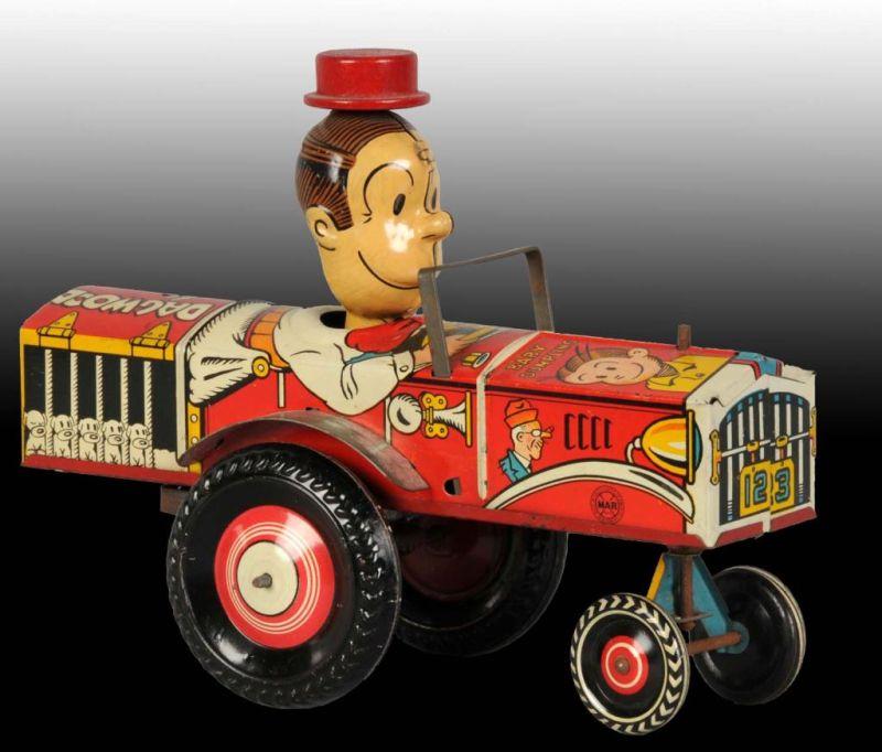 Appraisal: Tin Marx Dagwood the Driver Wind-Up Toy Description American Working