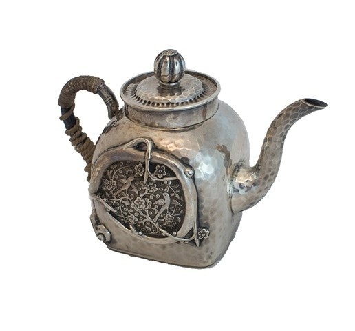 Appraisal: An Oriental teapot of curved square section form decorated within