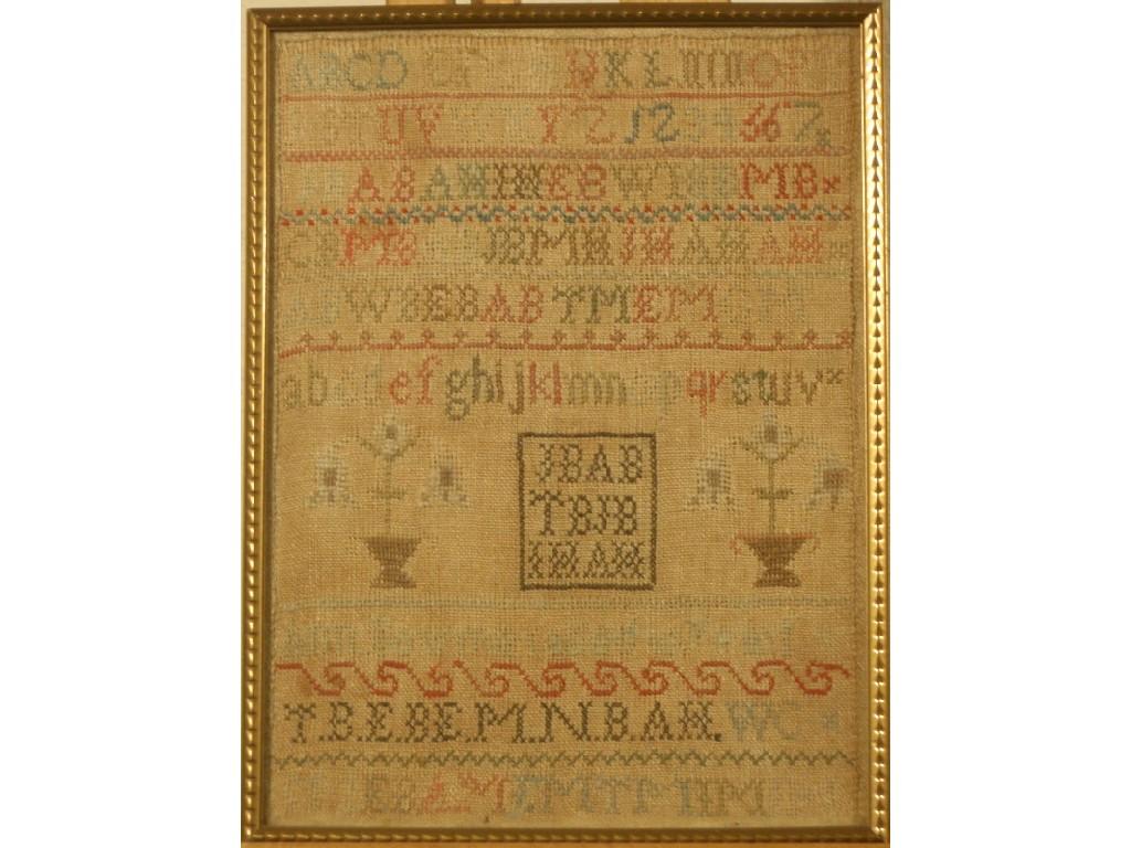 Appraisal: A thC sampler worked in coloured threads with the alphabet