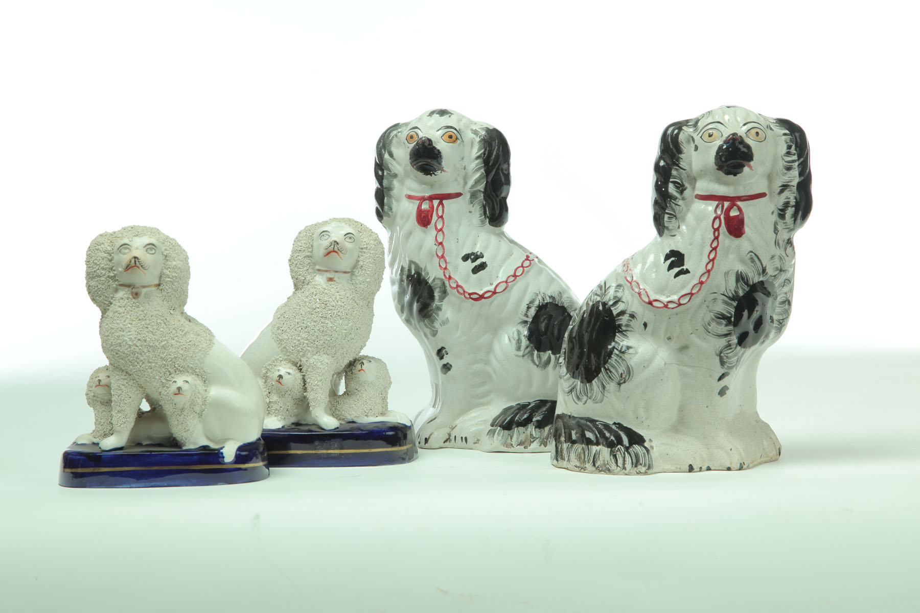 Appraisal: TWO PAIR OF STAFFORDSHIRE DOGS England nd half- th century