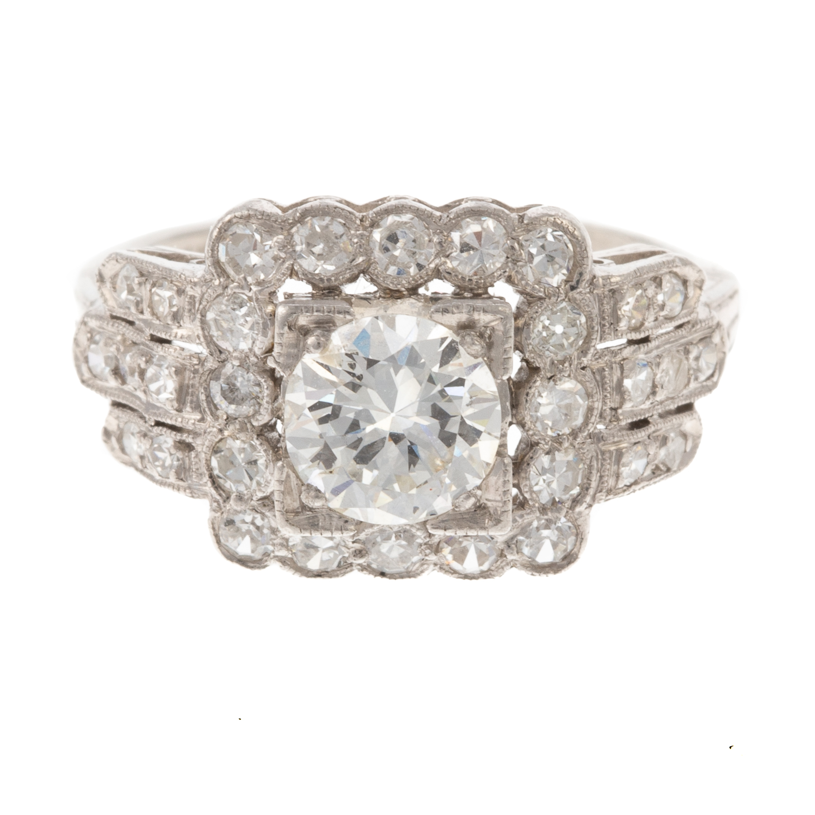 Appraisal: A VINTAGE DIAMOND CLUSTER RING IN PLATINUM Platinum vintage ring