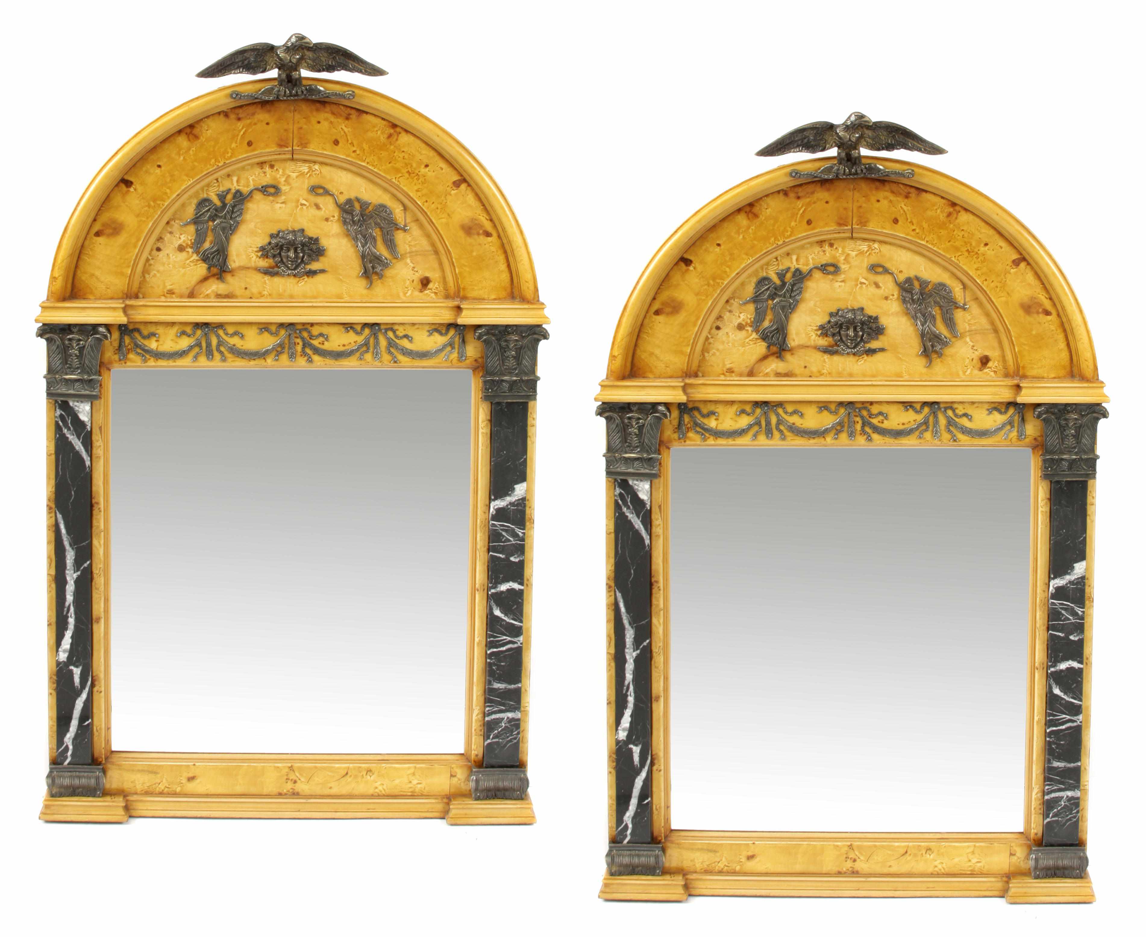 Appraisal: A pair of Empire style bronze and marble mounted mirrors