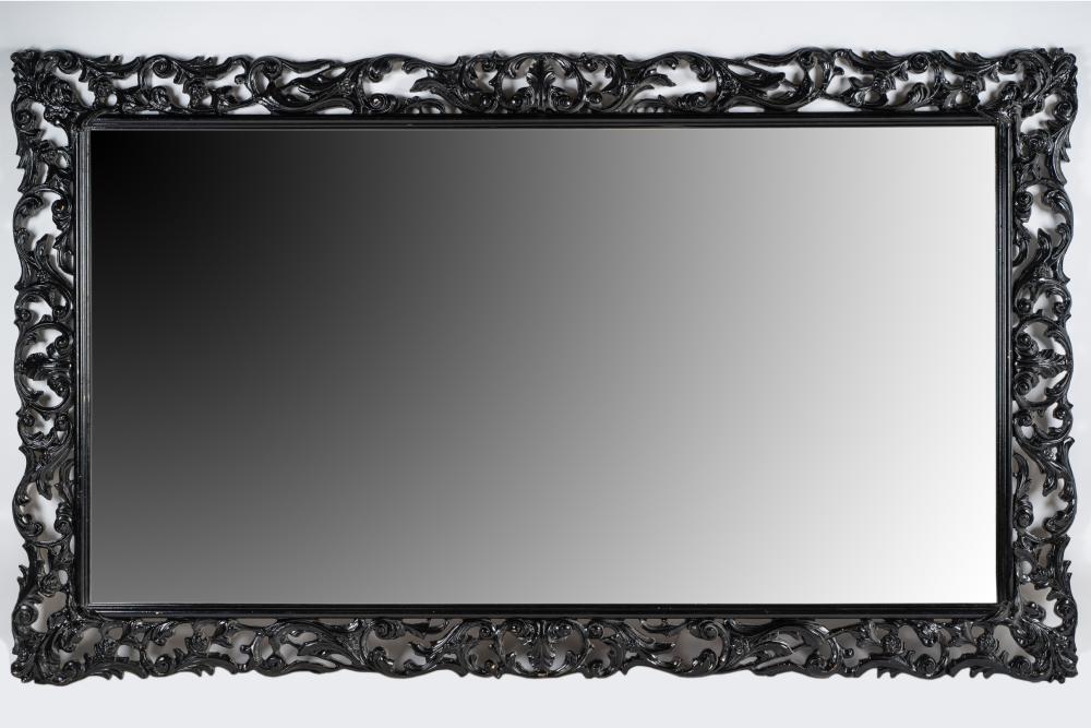 Appraisal: CONTINENTAL BAROQUE STYLE EBONIZED WOOD MIRRORwith beveled mirror plate Condition