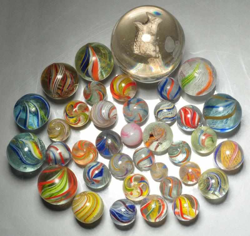 Appraisal: Lot of Assorted Handmade Marbles Description Includes one large sulphide