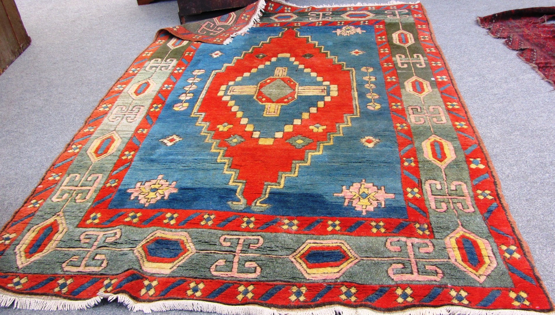 Appraisal: A Turkish carpet the indigo field with a madder and