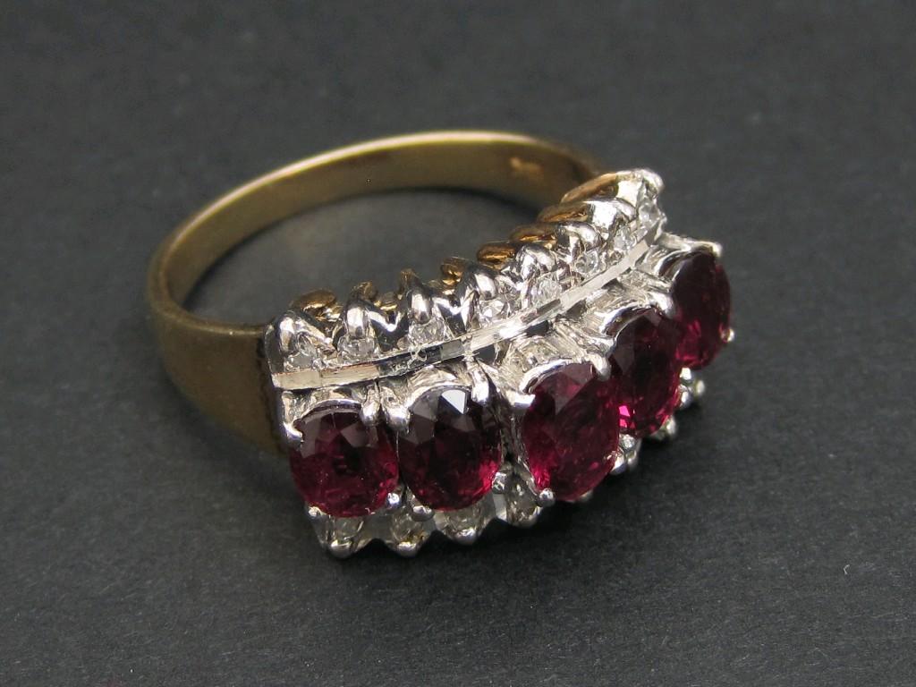 Appraisal: A Ruby and Diamond Ring pav -set five oval-cut rubies