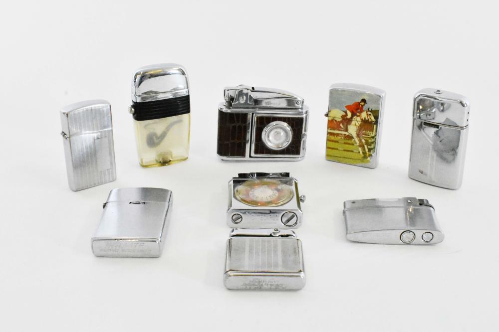 Appraisal: NINE VARIOUS VINTAGE CIGARETTE LIGHTERSIncluding an Aurora camera-form example a