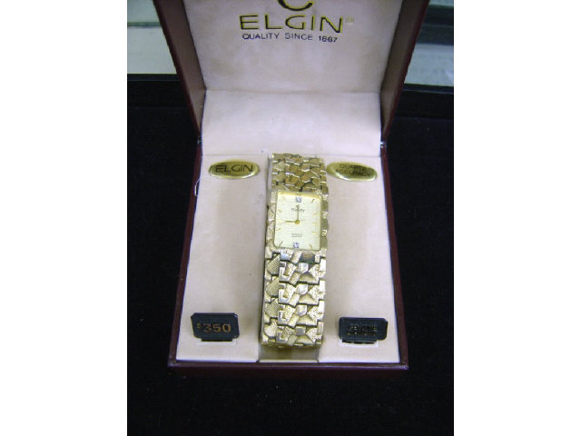 Appraisal: ELGIN NUGGET WATCH W DIAMONDS