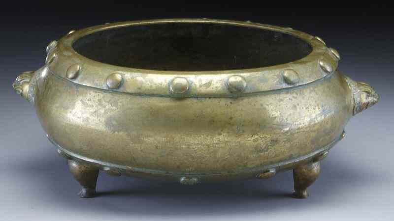 Appraisal: Chinese Qing drum shaped bronze tripod censer with two lion's