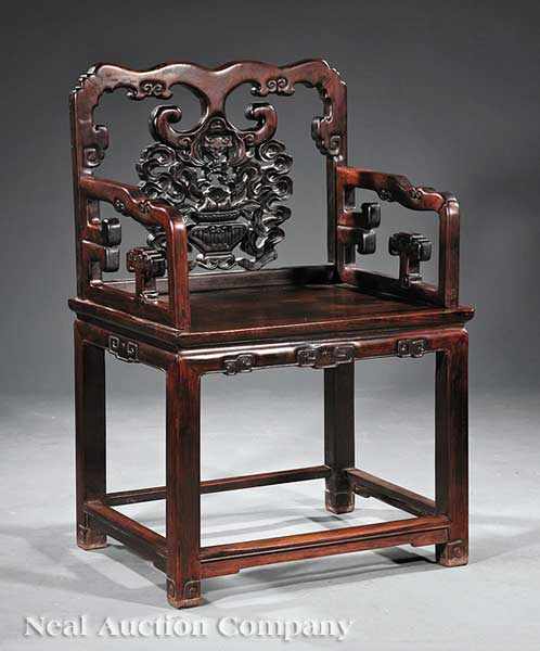 Appraisal: A Chinese Carved Hardwood Armchair probably Hongmu shaped back carved