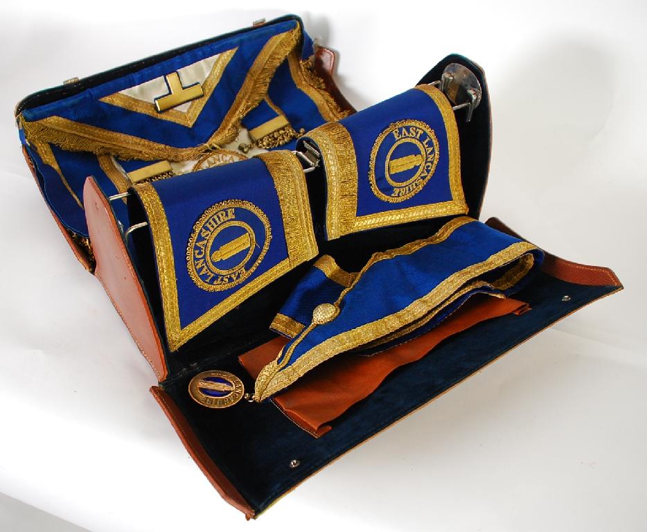 Appraisal: LEATHER BAG CONTAINING EAST LANCASHIRE MASONIC APRON sash suspending silver