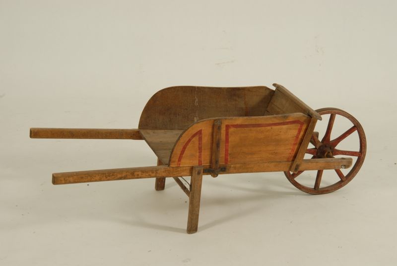 Appraisal: PARIS MAINE TOY WHEELBARROW Late th Early th CenturyIn yellow