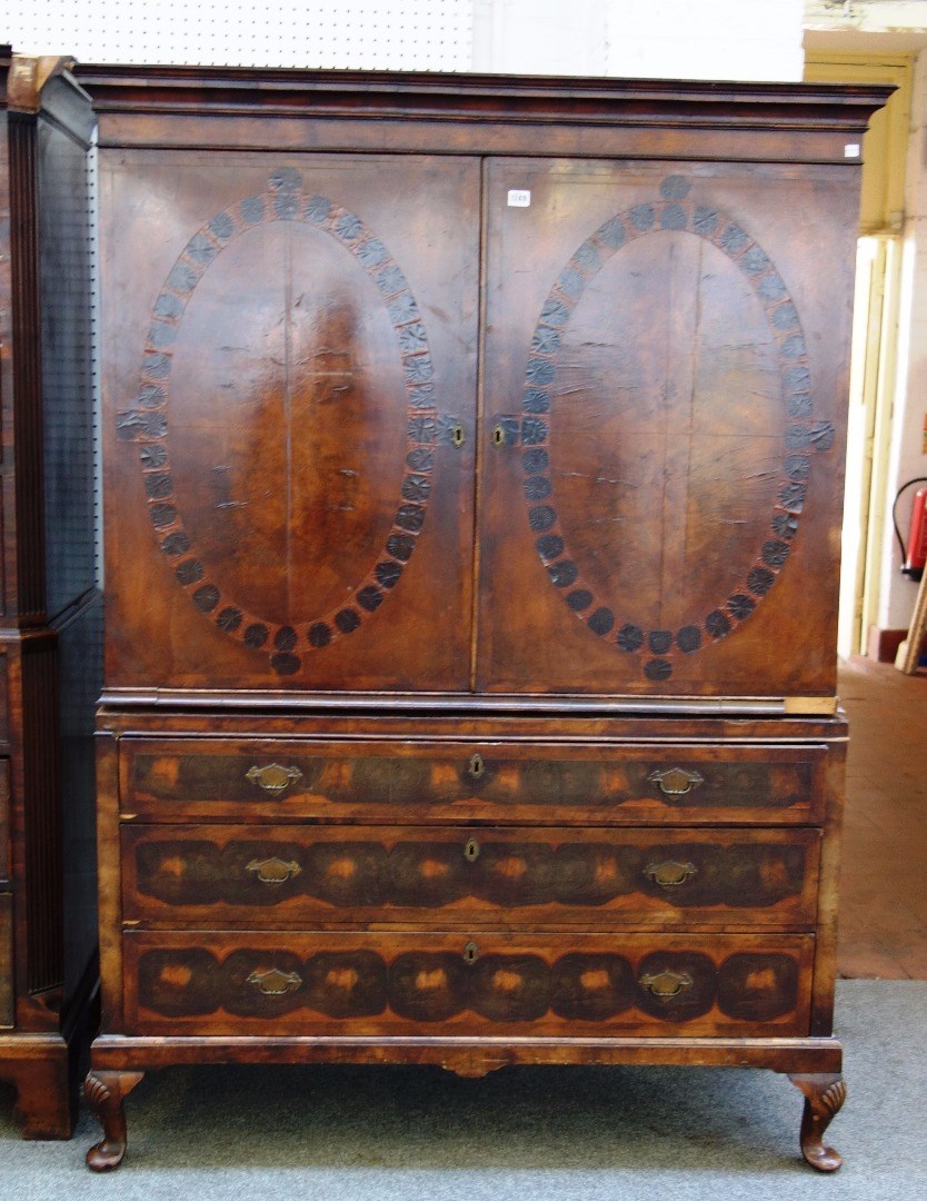 Appraisal: A George III and later oyster veneered cabinet on chest