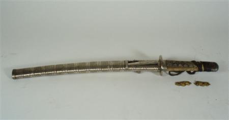 Appraisal: A Japanese wakizashi in a white metal saya blade cm