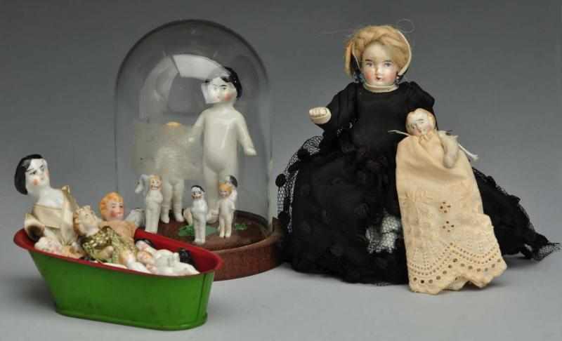 Appraisal: Lot of Tiny German Dolls Description Group of frozen charlottes