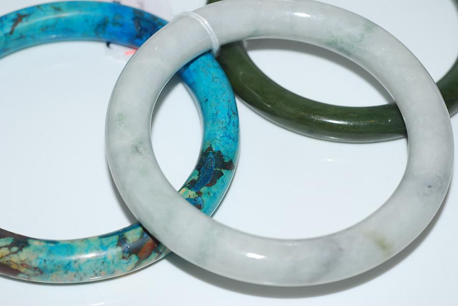 Appraisal: TWO JADE BANGLES AND A TURQUOISE BANGLE