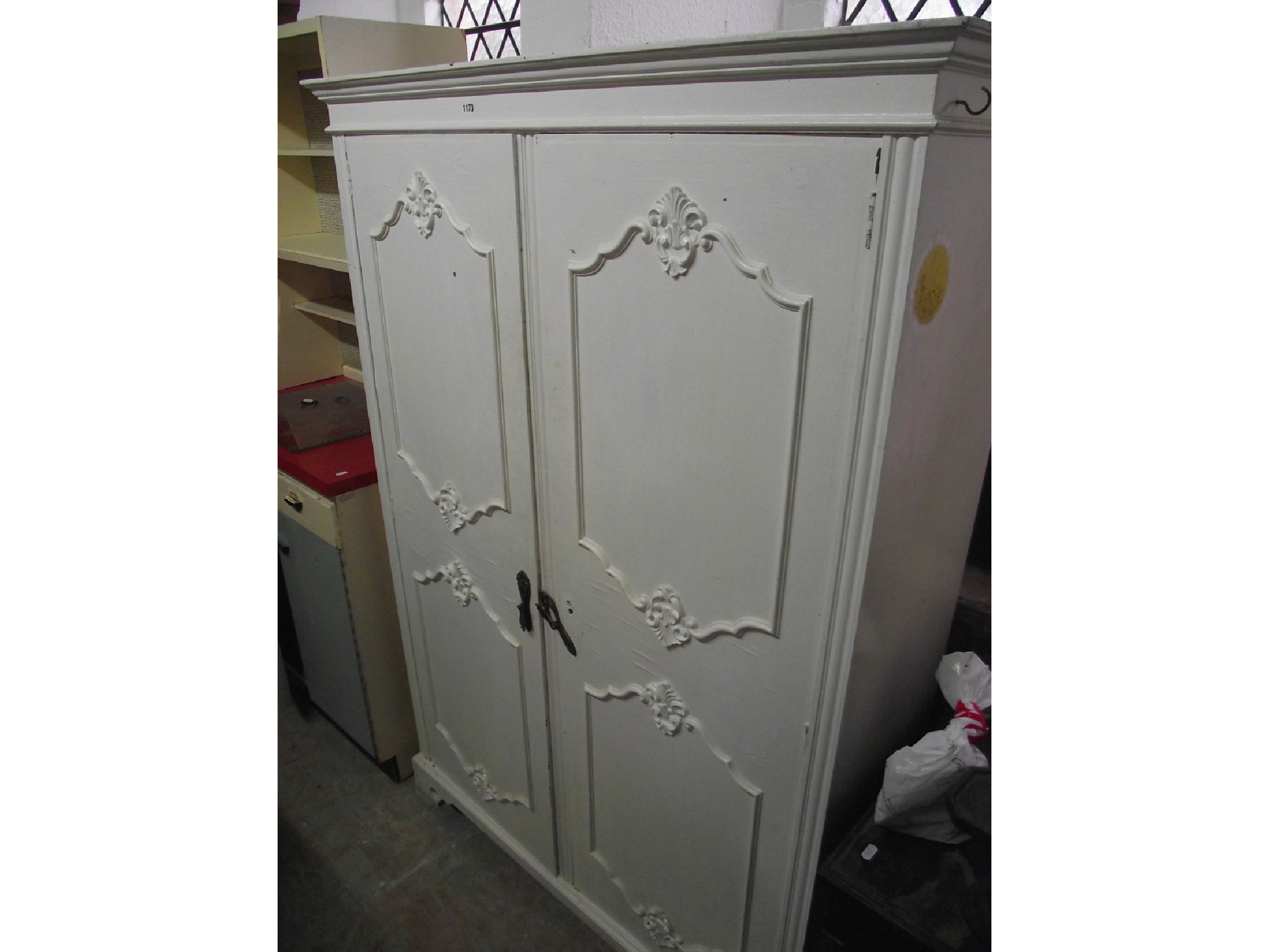 Appraisal: A hardwood freestanding side cupboard with later painted finish and