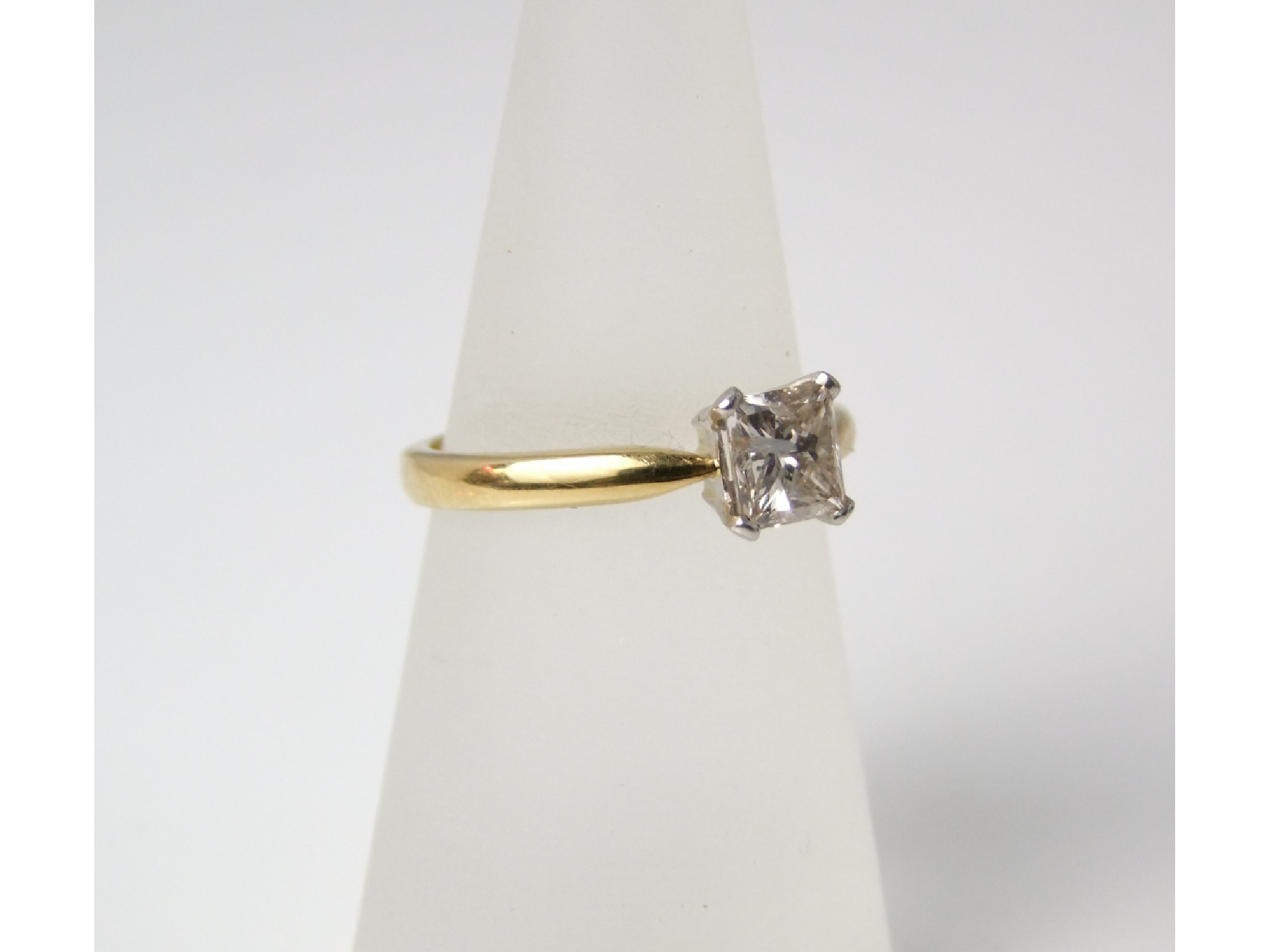 Appraisal: An ct gold solitaire diamond ring of square baguette form