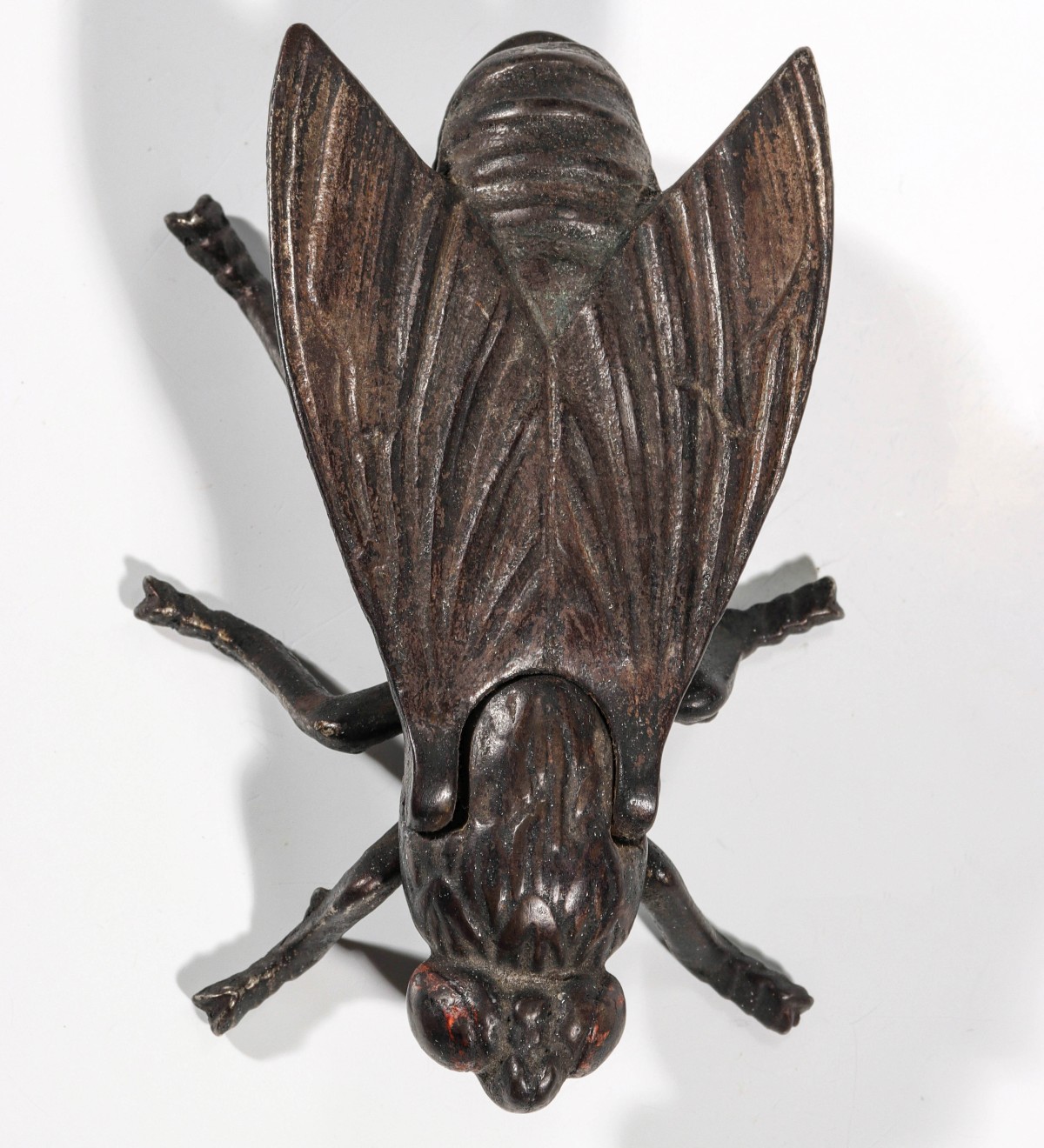 Appraisal: CAST IRON WINGED INSECT STOVE TOP MATCH SAFECirca Measures inches