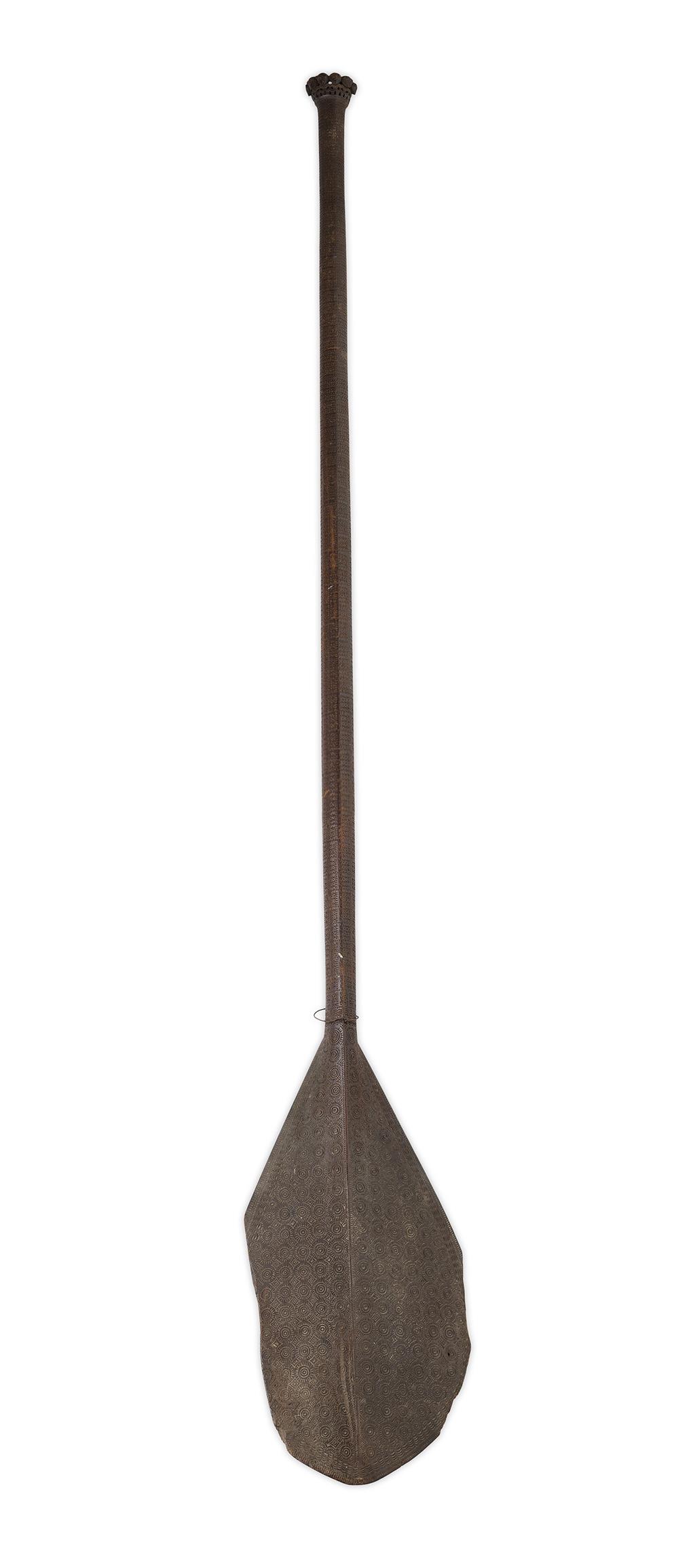 Appraisal: POLYNESIAN CARVED HARDWOOD PADDLE the carved handle depicting stylised figures