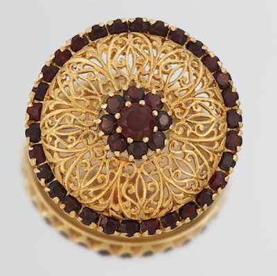 Appraisal: An k Gold and Garnet Brooch yellow gold reticulated design