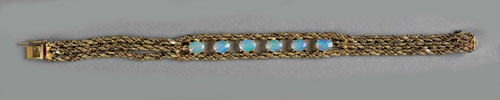 Appraisal: K yellow gold triple rope chain bracelet with opal cabochons