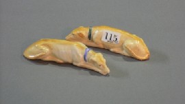 Appraisal: A Staffordshire pair of sleeping greyhounds