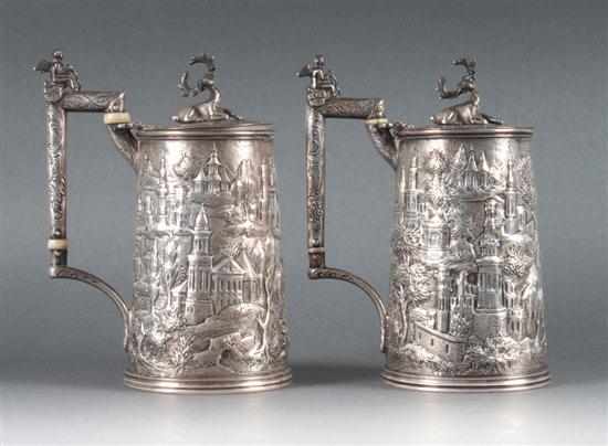 Appraisal: Pair of American repousse silver tankards in the ''Castle'' pattern