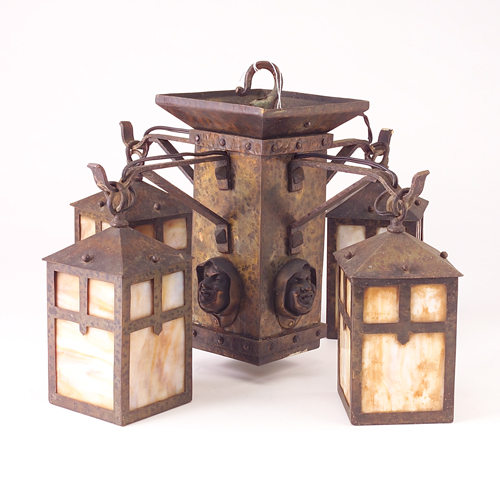 Appraisal: ARTS CRAFTS Chandelier with four lanterns lined in caramel slag