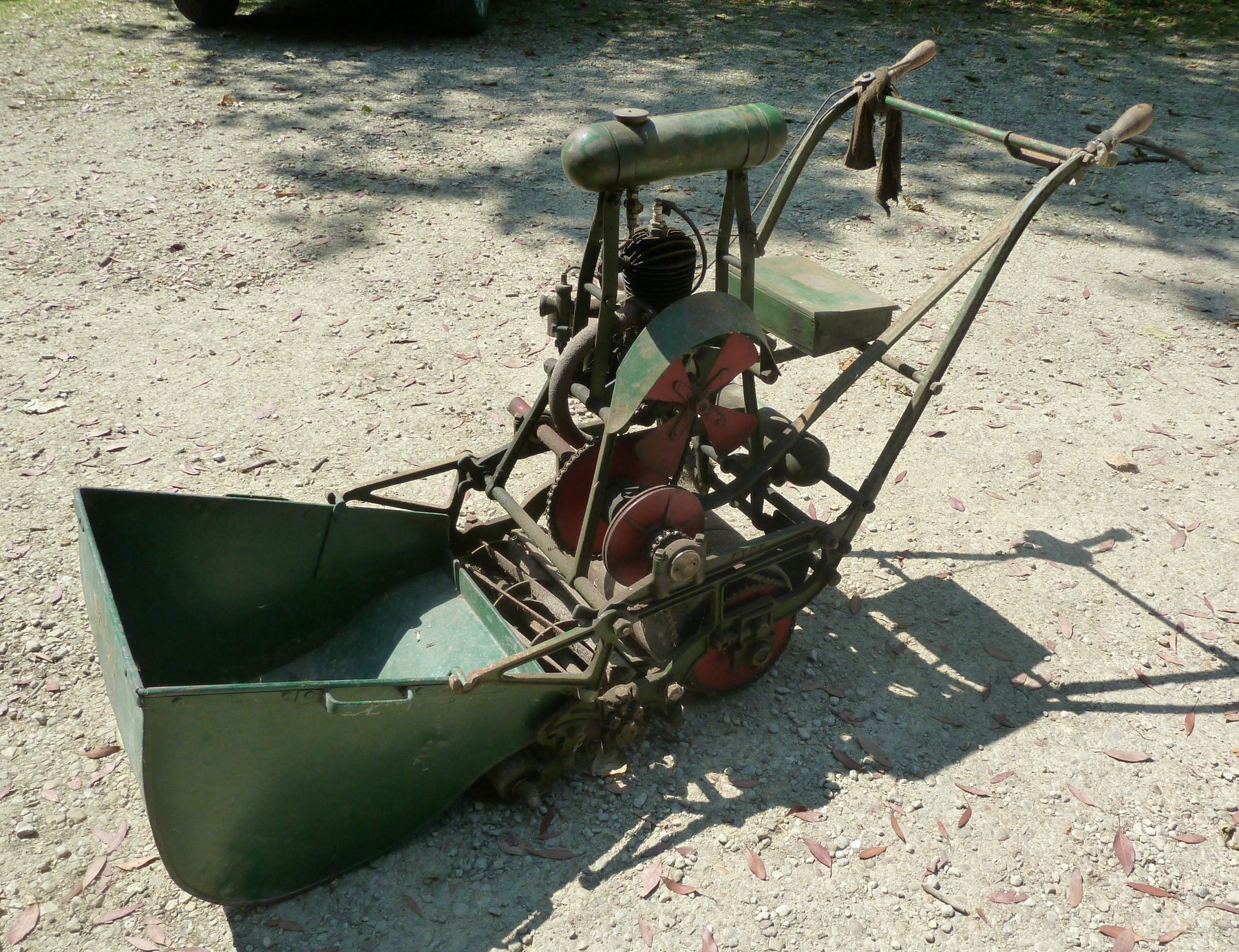 Appraisal: A vintage cast iron frame Atco lawn mower with torpedo