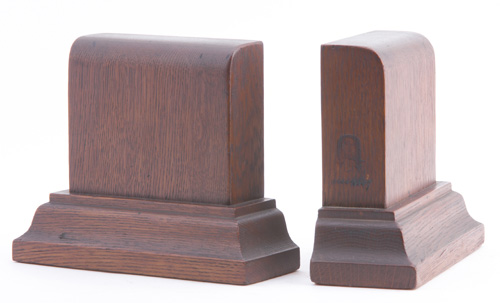 Appraisal: GUSTAV STICKLEY Oak bookends with moulding base From the collection