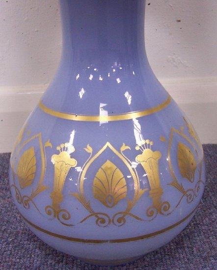 Appraisal: An opaque blue glass vase with band of gilded decoration