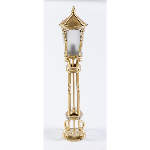 Appraisal: A brass newel post lantern c flambeau finial cm h