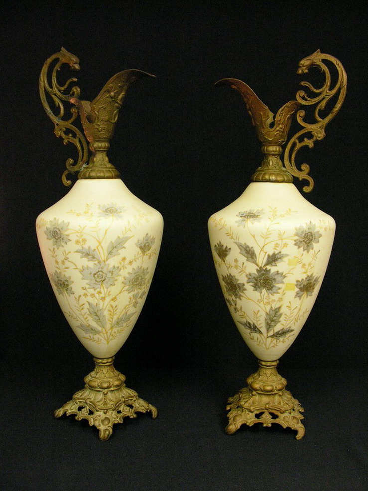 Appraisal: PAIR HAND PAINTED NON LUSTROUS EWERS Hand painted enamel floral