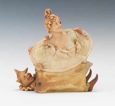 Appraisal: A Whimsical Art Nouveau Tobacco Jar with Clown and Beauty