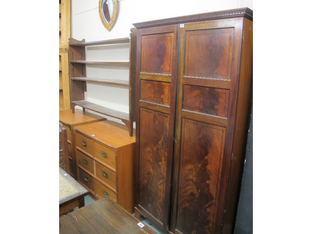 Appraisal: Mahogany two door wardrobe and an open bookcase