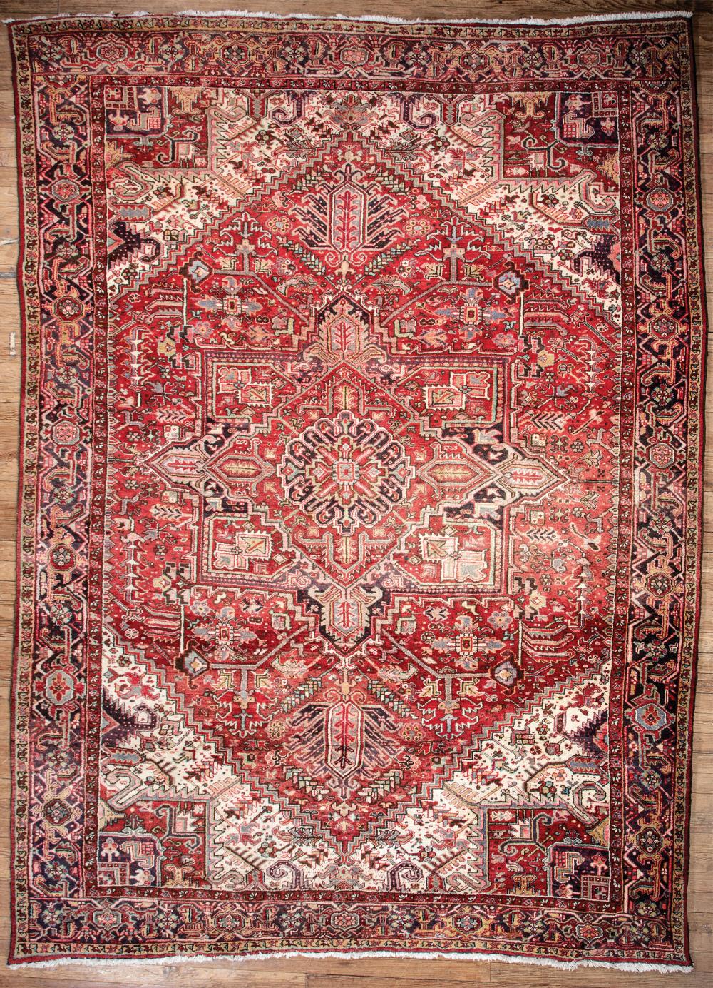 Appraisal: Antique Persian Carpet red and cream ground central medallion ft