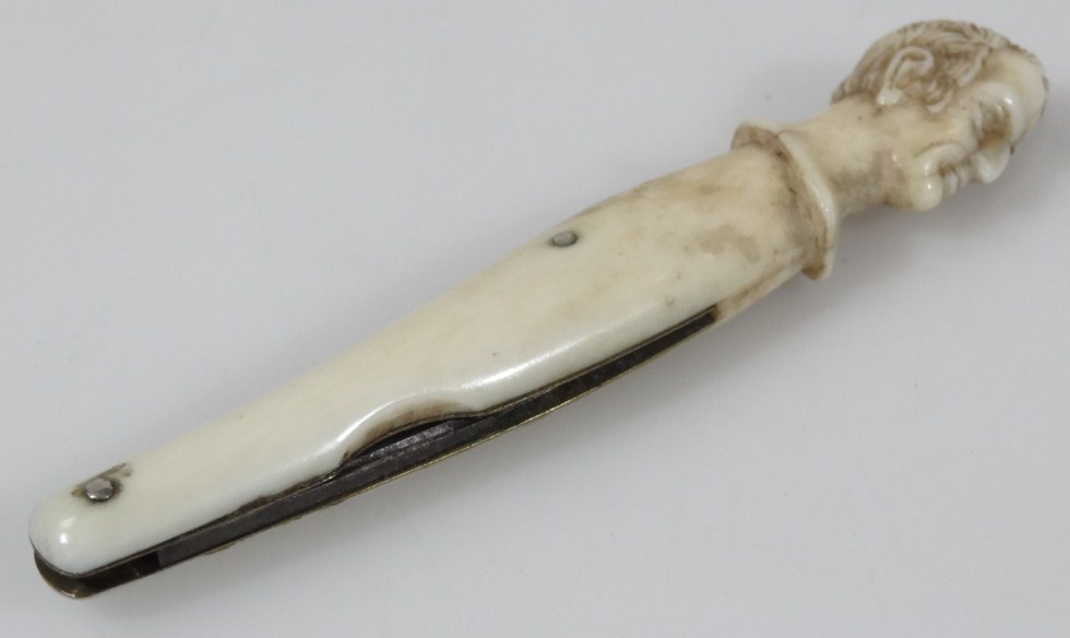 Appraisal: A thC ivory pen knife headed with a profile possibly