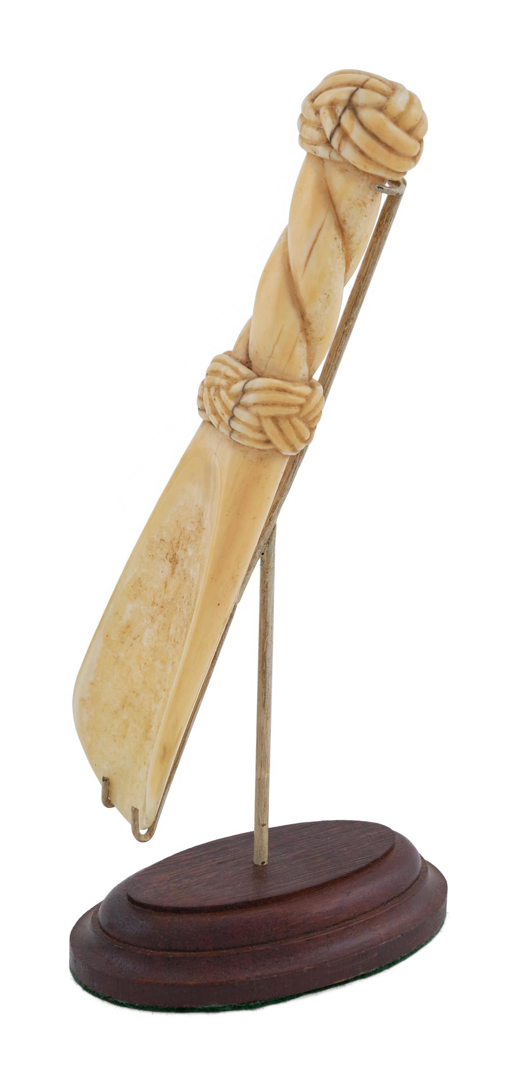 Appraisal: WALRUS IVORY SCOOP WITH ROPE CARVINGS MID- TH CENTURY LENGTH