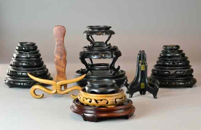 Appraisal: Chinese Carved Wood StandsTo include various solid and pierced wood