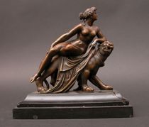 Appraisal: Neo-Classical Bronze with Lioness Reclining classical nude sits atop a