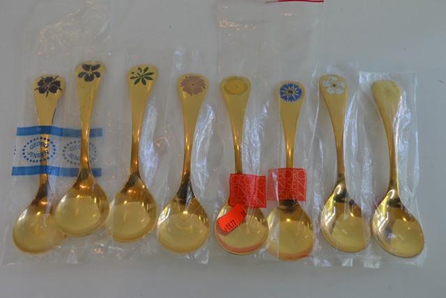 Appraisal: EIGHT GEORGE JENSEN GILT YEAR SPOONS -