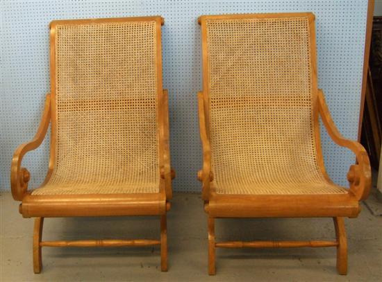 Appraisal: Pair of Colonial style bergere armchairs each on end supports