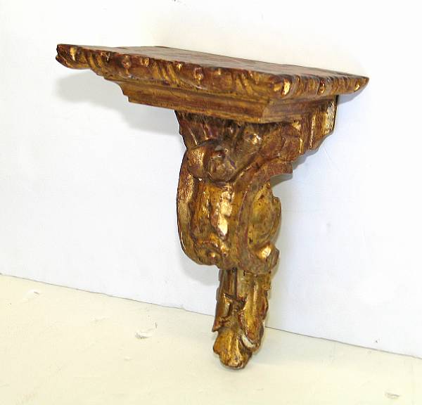 Appraisal: An Italian Baroque style carved giltwood bracket The rectangular top