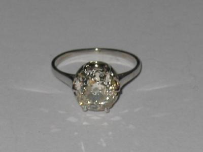 Appraisal: A SOLITAIRE DIAMOND RING the old cushion cut stone approximately