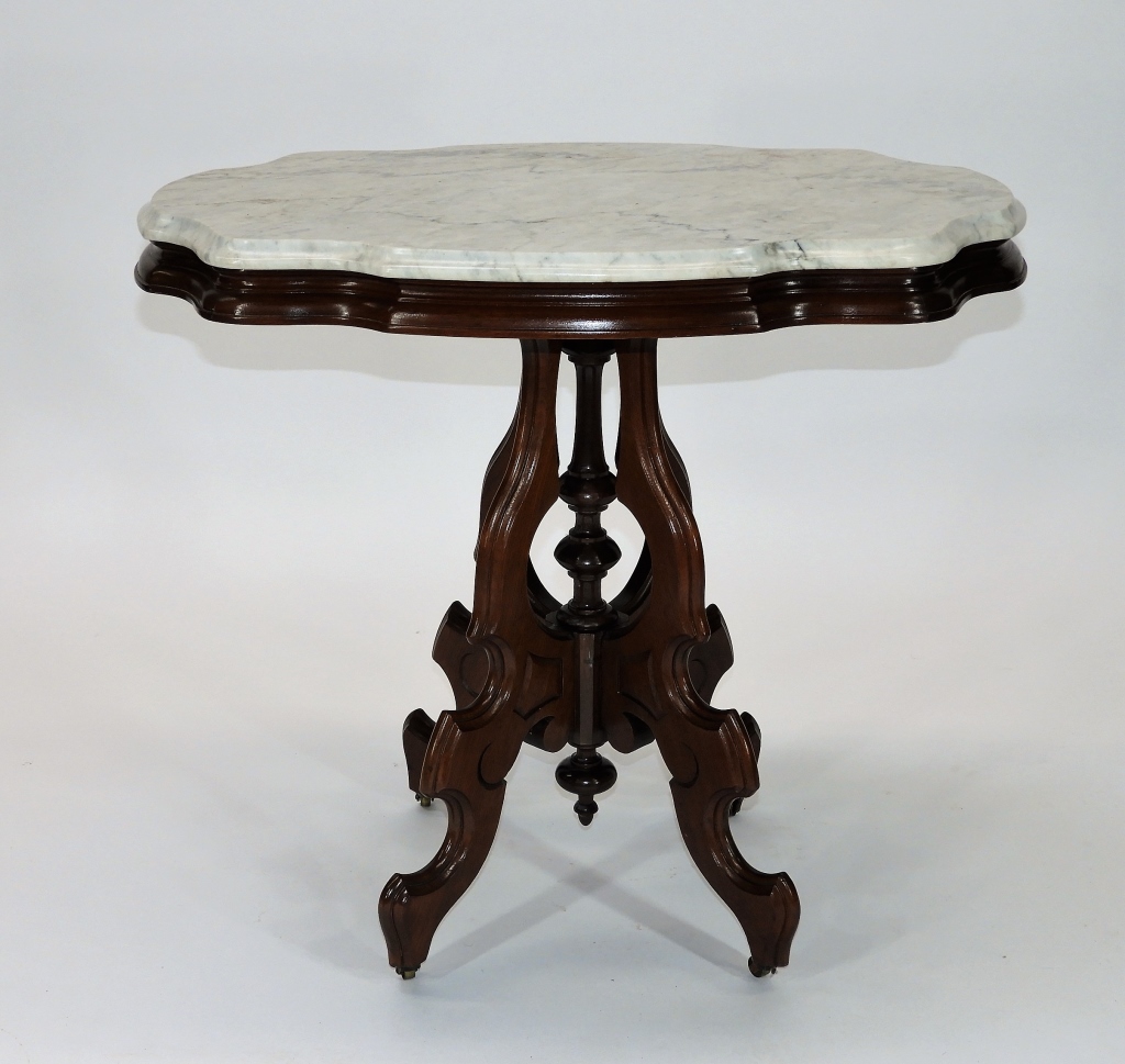 Appraisal: VICTORIAN WALNUT TURTLE MARBLE TOP TABLE United States Circa Turtle