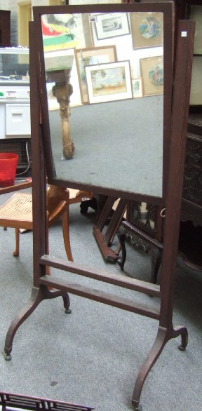 Appraisal: A th century mahogany framed cheval mirror with rectangular mirror